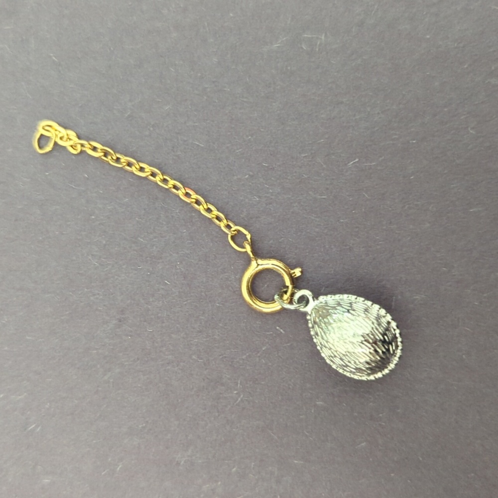 Vintage silver Joan Rivers egg charm and necklace extender